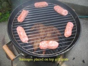 Sausages placed on top grill grate