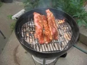 Ribs just placed in the rack on the hot grill