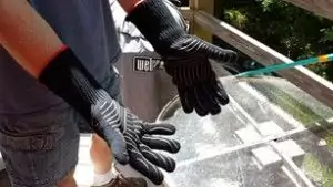 Wearing gloves right before grilling.